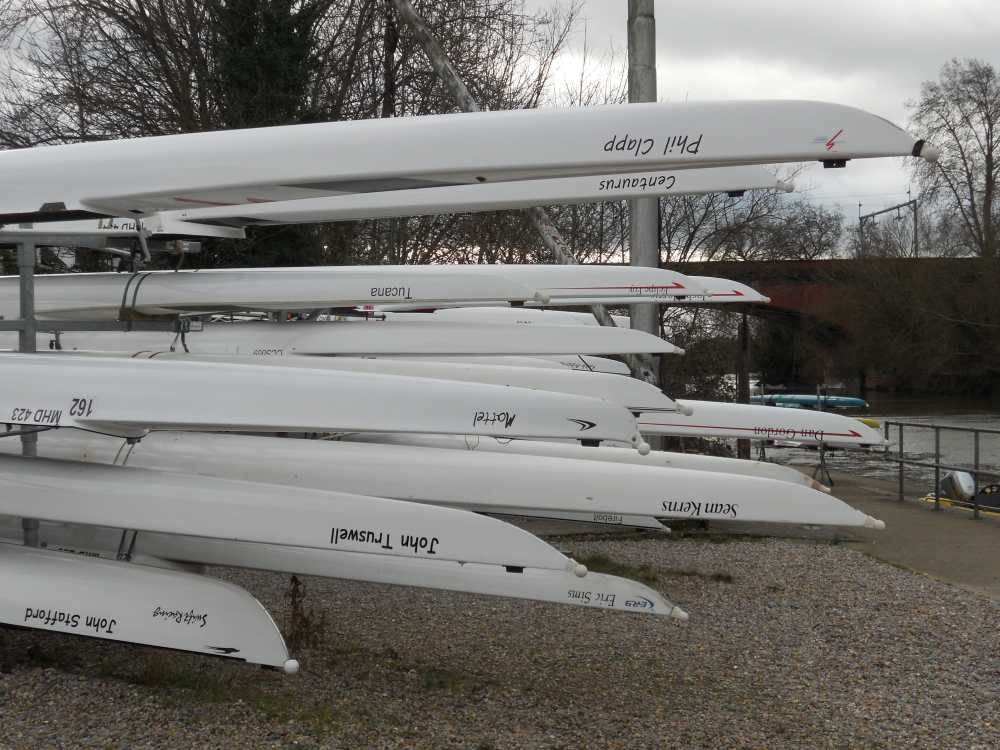 Rowing boats at rest besides the River Thames