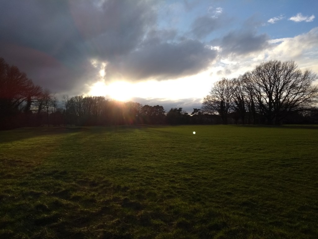 Sun setting over the fairway